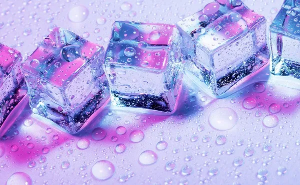 a group of ice cubes with water droplets